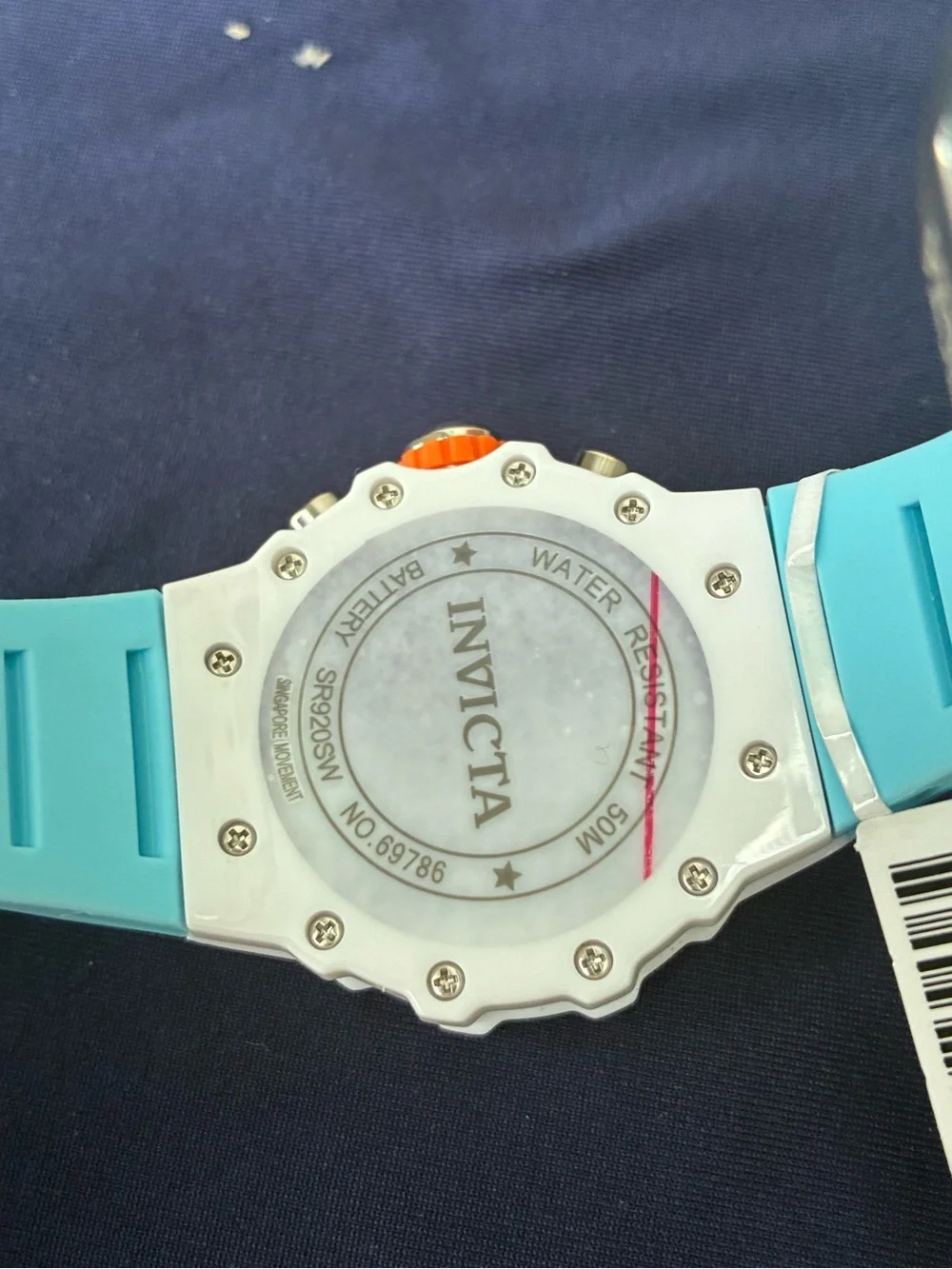 Invicta White Watch with Coral Orange Bezel and Aqua Strap